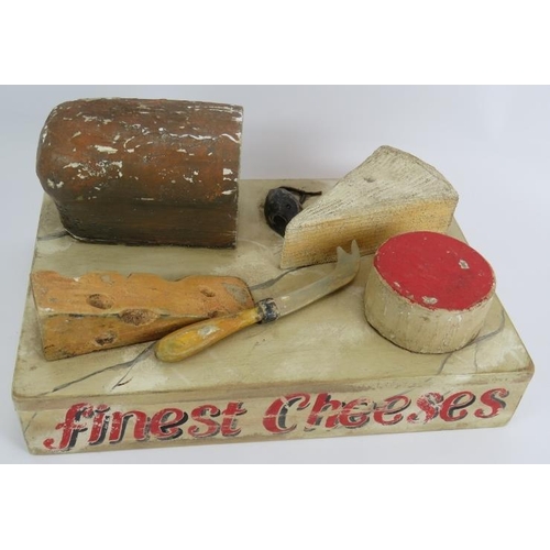 22 - A vintage 1950s shop display cheese board constructed of hand painted wood and sign written 'Finest ... 