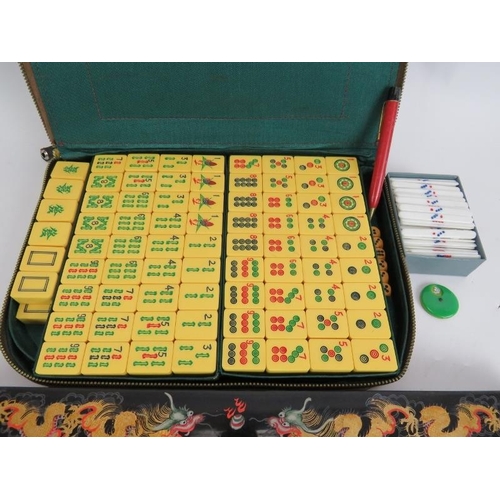 220 - A vintage 1950s Chinese Mah Jong set with four hand decorated lacquer tile stands and zip up carry c... 