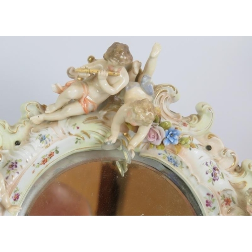 229 - A continental porcelain dressing table mirror with Putti decoration, a Beswick horse, a Staffordshir... 