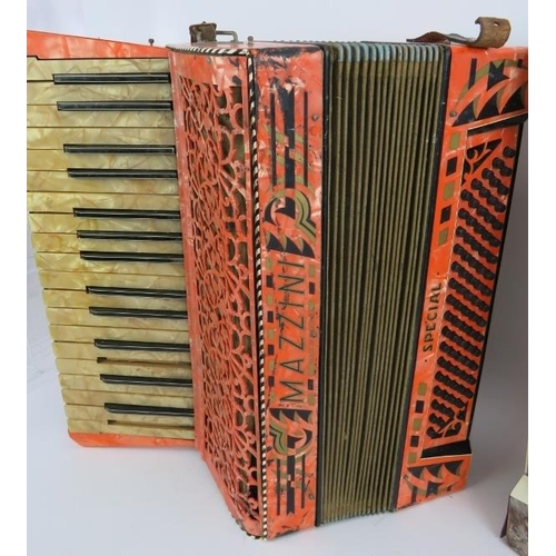 232 - Two vintage piano accordions, one Mazzini special with orange marbled body and one peretta. (2).
Con... 