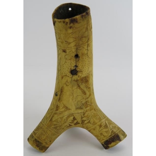 24 - A 16th/17th century scrimshaw decorated antler powder flask, probably German. Intricately carved wit... 