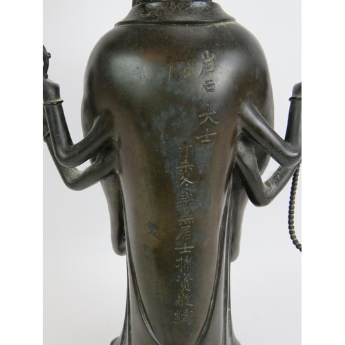 3 - An antique Chinese bronze figure of a Deity, probably the Buddhist Goddess Marici, with Chinese scri... 