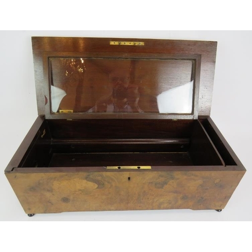 32 - An antique music box case with burr walnut veneer and inlaid lid. Internal glass cover and drop end ... 