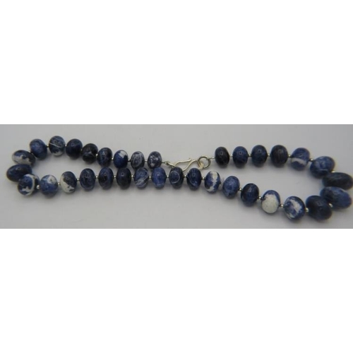 360 - A sodalite necklace with small interspersed white metal beads & white metal 'S' shaped clasp. Approx... 