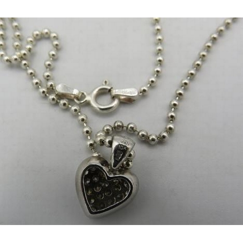 364 - A 10ct white gold heart shaped pendant encrusted with diamonds on a silver ball chain and a pair of ... 