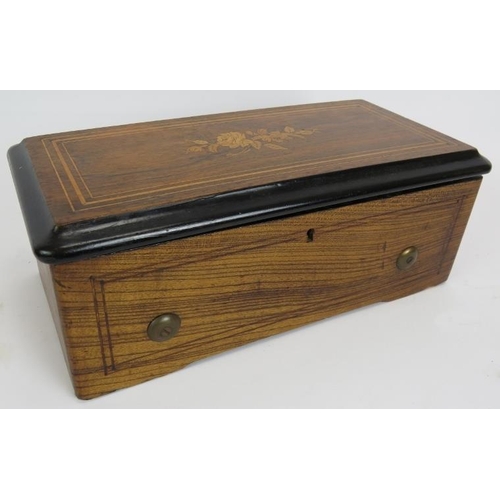 37 - A small antique Swiss music box with lever wind mechanism in an inlaid wooden case. 34cm x 17cm x 13... 