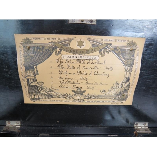 38 - A small antique Swiss music box with lever wind mechanism original label and inlaid case. 35cm x 19c... 