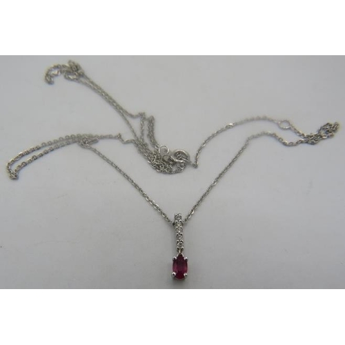 386 - A white metal small ruby and five small diamond pendant on a fine 9ct white gold chain. Ruby approx ... 