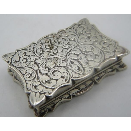 392 - A Victorian silver vinaigrette with foliate design, gilded interior and complete with sponges, Londo... 