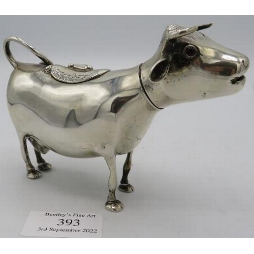 393 - A continental white metal cream jug in the form of a cow, indistinct markings. Approx weight 4.8 tro... 