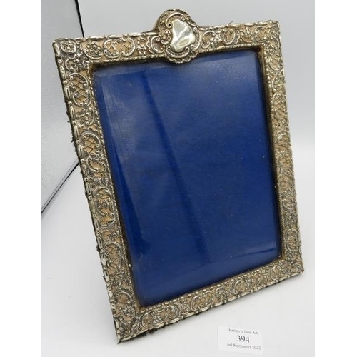 394 - A silver embossed photograph frame, Chester 1899, approx 10