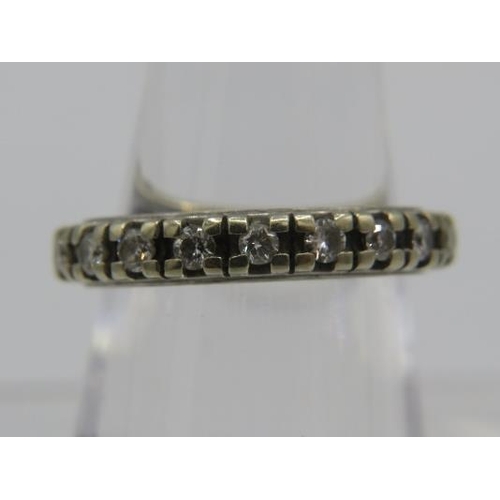 397 - A diamond & white metal eternity ring containing twenty diamonds, total 0.6cts approx, size N.
Condi... 