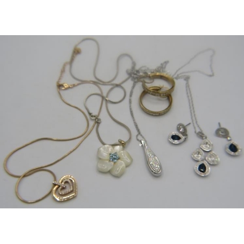 404 - A collection of mainly Swarovski jewellery to include a yellow metal heart shaped pendant set with m... 