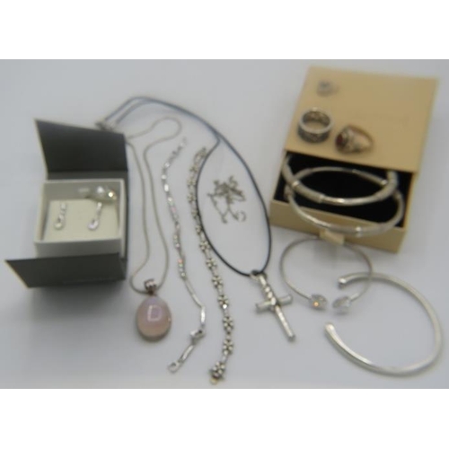 405 - A rose quartz pendant marked 925 on a 925 chain, two bangles marked 925, one bracelet marked 925 wit... 