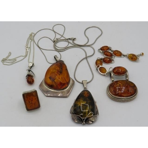 408 - A collection of amber jewellery to include two large pendants marked 925 & on 925 marked chains, a r... 