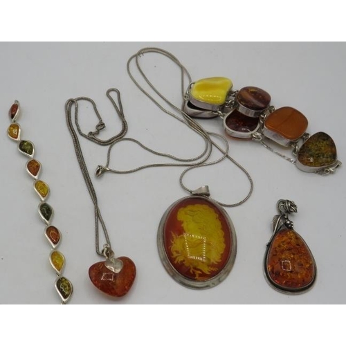 409 - Four items of amber jewellery, all marked 925 to include a heart shaped pendant on a 925 stamped cha... 