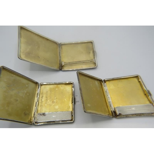 424 - A collection of three silver cigarette cases with engine turned decoration. One Royal Army Medical C... 