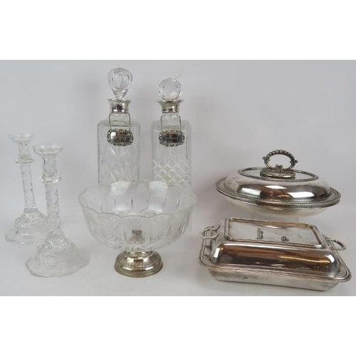 425 - A pair of cut crystal glass candlesticks, two spirit decanters, one with hallmarked silver collar, t... 