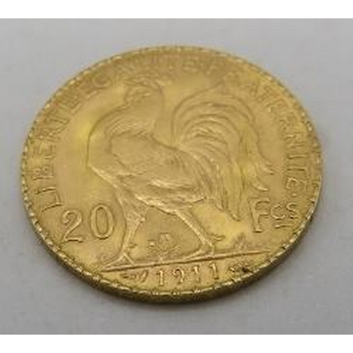 428 - A 1911 Republique Francaise 20 francs gold coin, approx weight 6.5 grams.
Condition report: Slight s... 