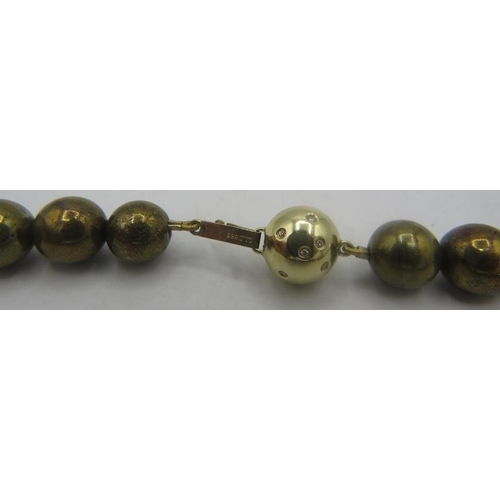 433 - A gold pyrite necklace interspersed with yellow metal beads. The 14ct gold ball clasp is set with 12... 