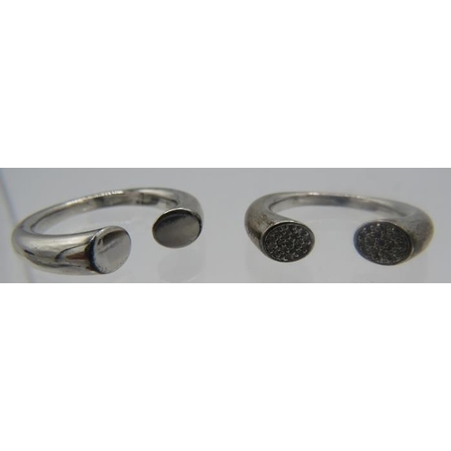 439 - Two Amanda Wakeley silver rings stamped 925. One of the rings has a small cluster of diamonds each e... 