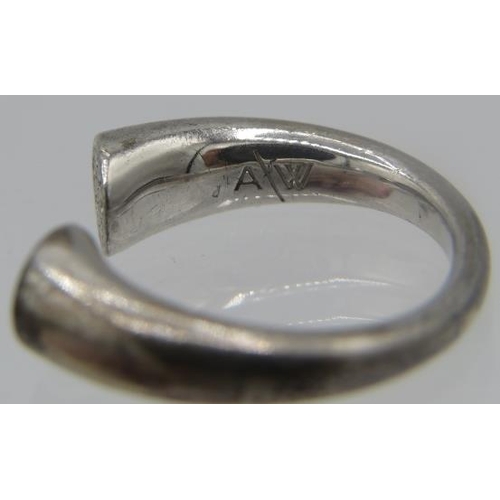 439 - Two Amanda Wakeley silver rings stamped 925. One of the rings has a small cluster of diamonds each e... 