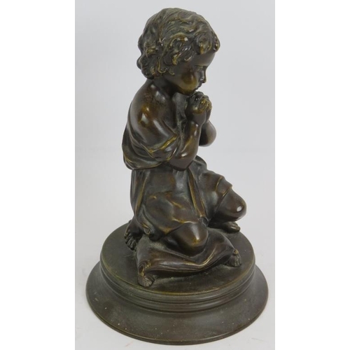 44 - A small European bronze figure of a praying child kneeling on a cushion. Unsigned. Height 23cm.
Cond... 