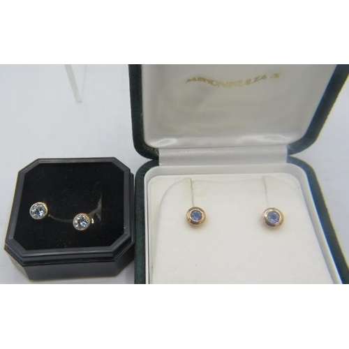 442 - A pair of 14ct yellow gold stud earrings inset with sapphires and a pair of 14ct yellow gold stud ea... 