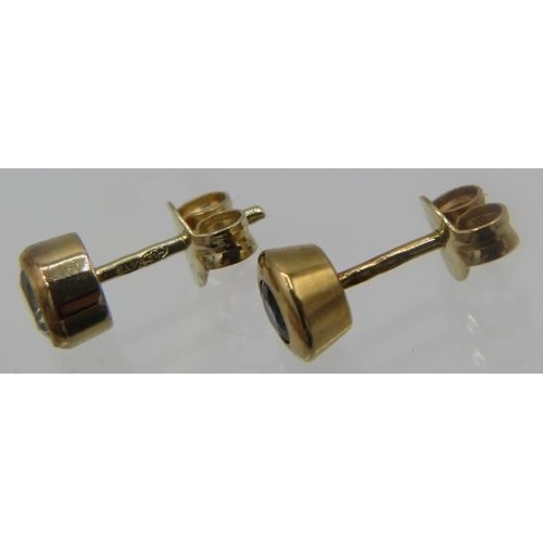 442 - A pair of 14ct yellow gold stud earrings inset with sapphires and a pair of 14ct yellow gold stud ea... 