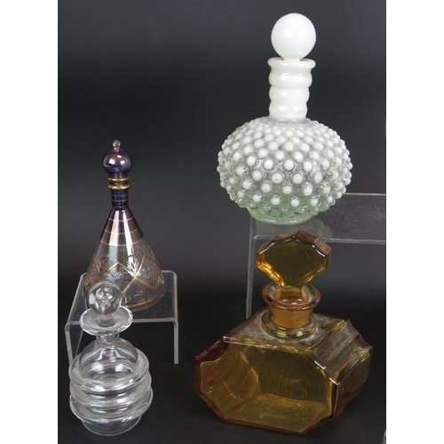 45 - A collection of ten glass scent bottles, two with silver mounts, five cut glass and one signed. Tall... 