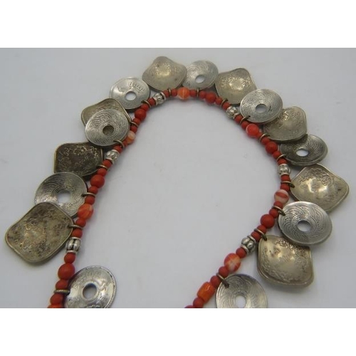 461 - A Nepalese bead, coral & coin tribal necklace with sterling silver clasp. Approx 18