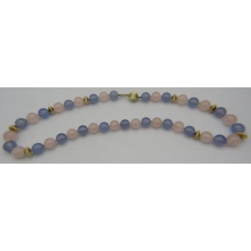 464 - A Madagascan rose quartz & blue chalcedony necklace. Interspersed with yellow metal spacers on a 14c... 