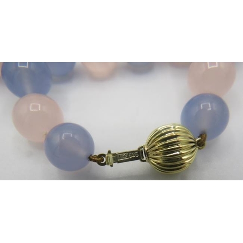 464 - A Madagascan rose quartz & blue chalcedony necklace. Interspersed with yellow metal spacers on a 14c... 