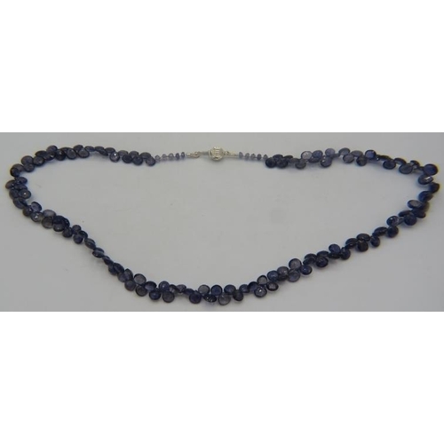 469 - An iolite briolette necklace with white metal ball clasp, approx 18