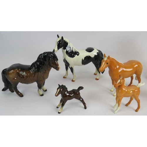 47 - A collection of Beswick pottery animals including horses, owls and cats. Tallest 19cm. (9).
Conditio... 