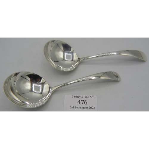 476 - A pair of silver sauce ladles, Sheffield 1948, Hukins & Heath. Approx weight 2 troy oz/64 grams.
Con... 