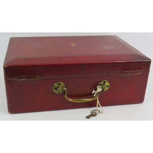 51 - A George V British Government ministerial despatch box in red leather with gold block royal cypher a... 