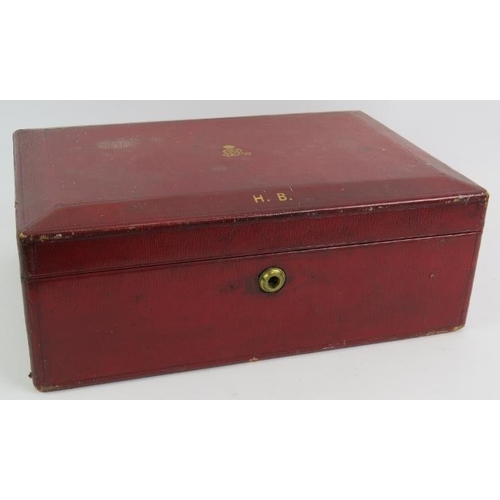 51 - A George V British Government ministerial despatch box in red leather with gold block royal cypher a... 