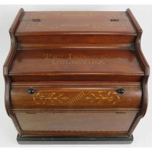 56 - A late 19th century Celestina organette in walnut case with gilt decoration and bearing a retailer's... 