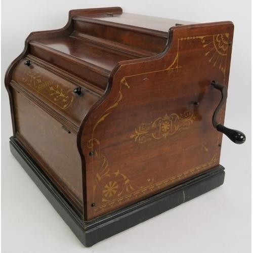 56 - A late 19th century Celestina organette in walnut case with gilt decoration and bearing a retailer's... 