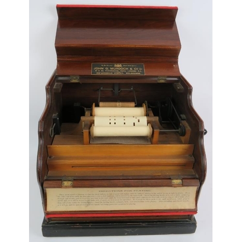 56 - A late 19th century Celestina organette in walnut case with gilt decoration and bearing a retailer's... 