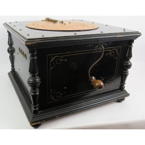 58 - An antique Ariston 24 note organette in gilt decorated ebonised case with a large quantity of 13