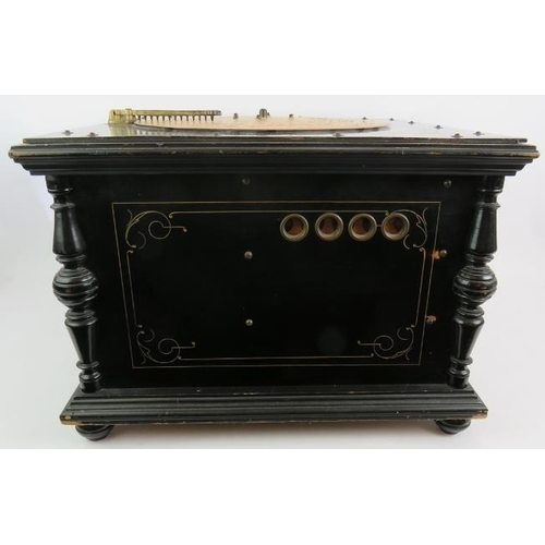 58 - An antique Ariston 24 note organette in gilt decorated ebonised case with a large quantity of 13