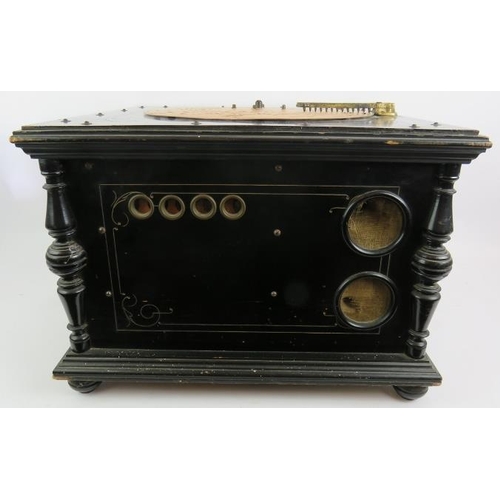 58 - An antique Ariston 24 note organette in gilt decorated ebonised case with a large quantity of 13