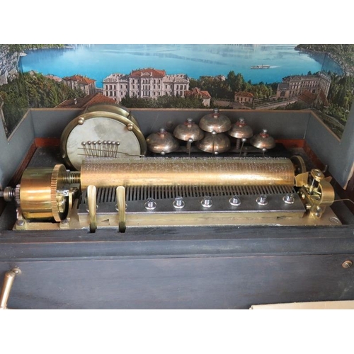 59 - A late 19th century coin operated musical box playing ten airs accompanied by six bells and a drum. ... 