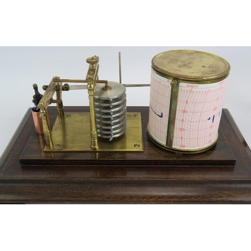 62 - An oak framed glazed cased barograph with key and ink bottle. 38cm x 23cm x 19cm.
Condition report: ... 