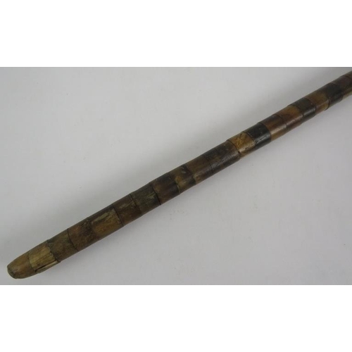 63 - An antique walking cane consisting of graduated sectional horn pieces. Length 86cm. 
Condition repor... 