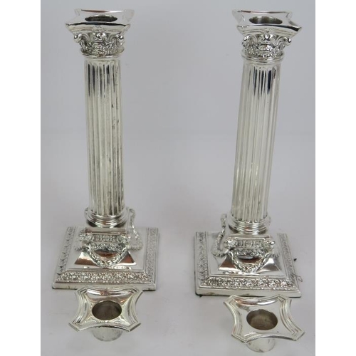 69 - A fine pair of antique silver plated Corinthian column candlesticks and a four candle candelabra wit... 