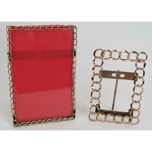 70 - An antique silver plated scroll work photo frame, 35cm x 24cm, a smaller brass chain link photo fram... 