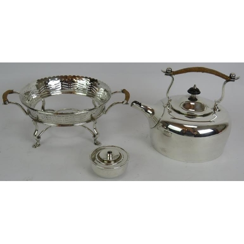 73 - A silver plated spirit kettle and stand with rattan handle, a similar teapot and two plated Jersey c... 